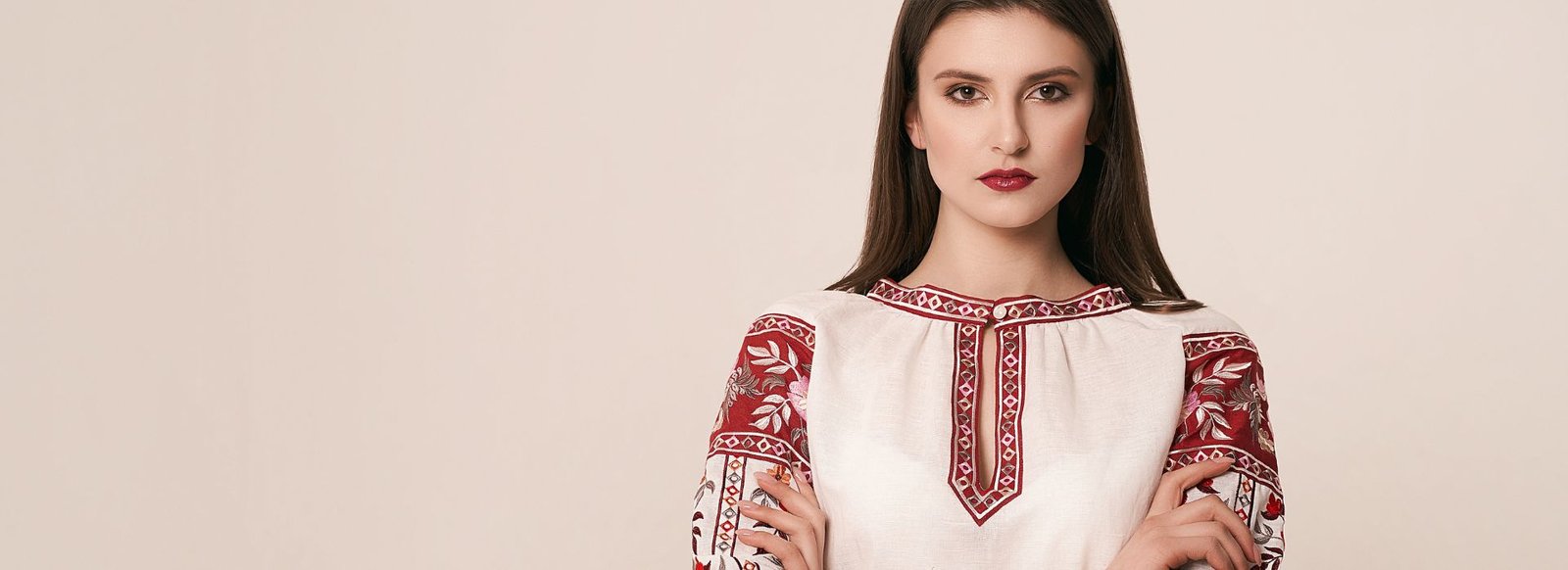 White kurti with red embroidered sleeves and neckline