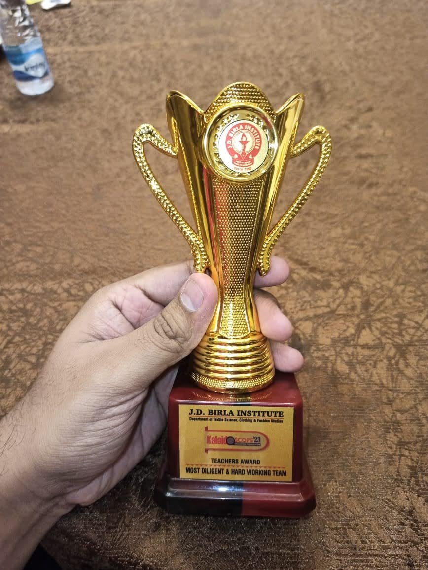 The Kaleidoscope '23 trophy held in hand on the award day